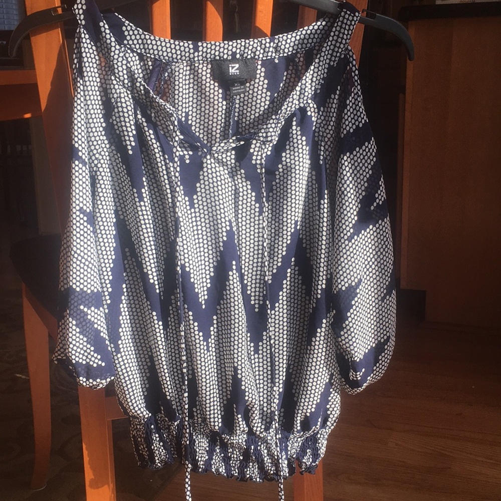 Blue and white long sleeve iZ Buyer shirt.